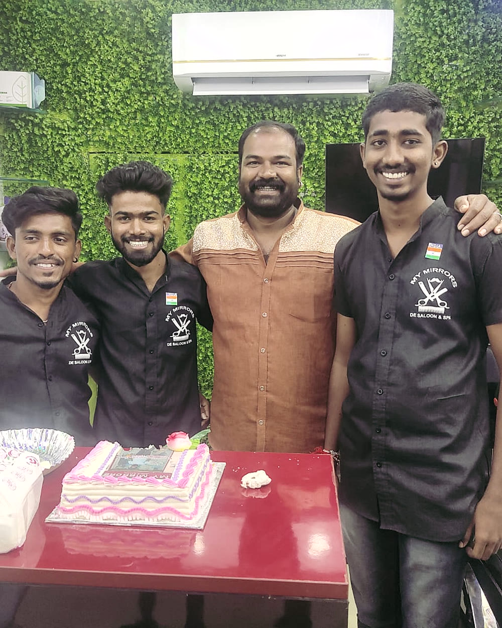 The staff of My Mirrors in shop uniform, Nandigama